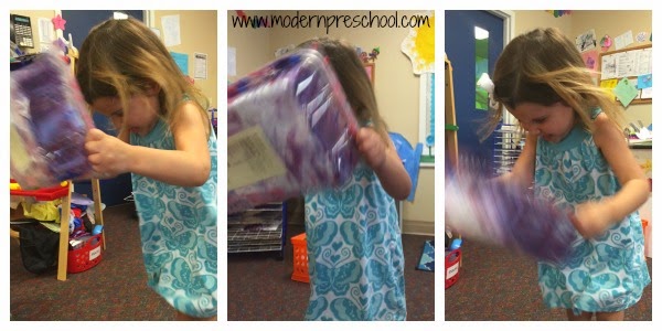 Making purple mixing colors to an egg shaking song in preschool from Modern Preschool