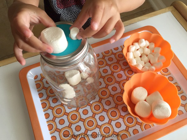 Sort marshmallows by size in this fine motor jar for preschoolers from Modern Preschool