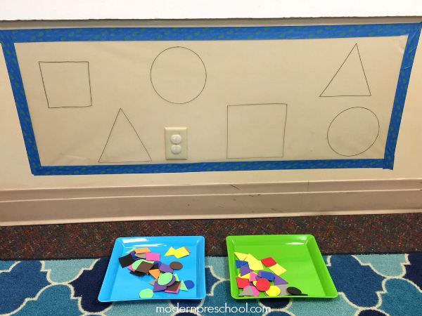 Shape sorting sticky wall with reusable craft foam stickers from Modern Preschool!
