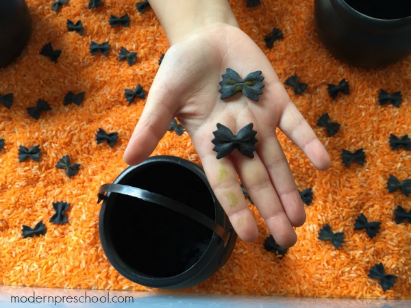 Halloween black bat fine motor sensory bin for preschoolers and toddlers from Modern Preschool!