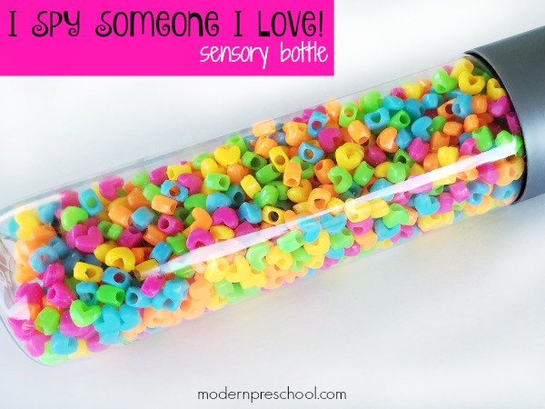 Super simple "I Spy Love" Sensory Bottle for toddlers and preschoolers to practice visual discrimination, identification skills, and calming down during circle time, in a reading corner, or at home during a Valentine's Day or hearts theme!