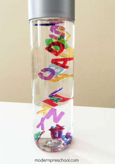Practice letter identification, colors & counting with this super simple Rainbow Alphabet Letter Sensory Bottle! FREE printable letter matching game included.