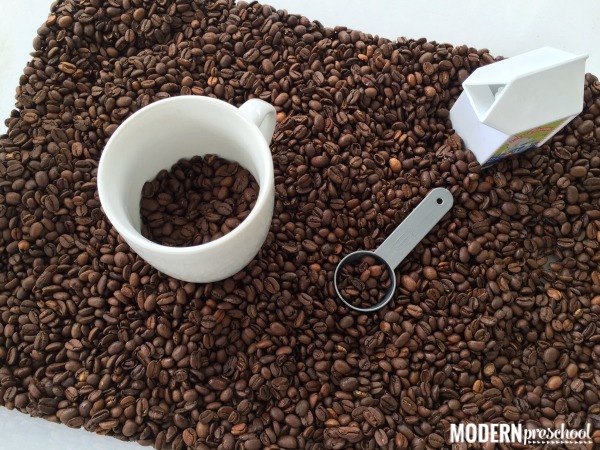 Preschoolers and toddlers will love the smell of the coffee beans during pretend play and exploration in this coffee bean sensory bin!