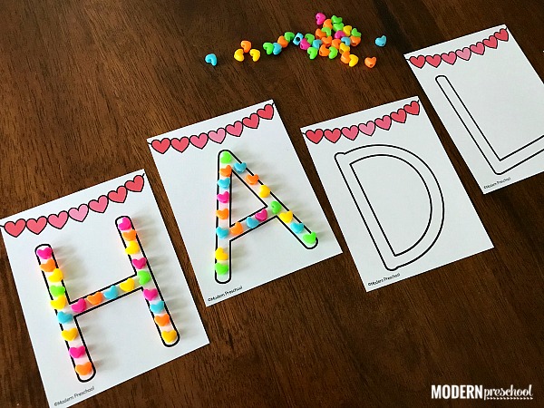 FREE name recognition alphabet hearts printable busy bag for Valentine's Day in preschool to practice uppercase letters in names, letter recognition, and fine motor skills. Perfect idea for welcome work or in a literacy learning center.